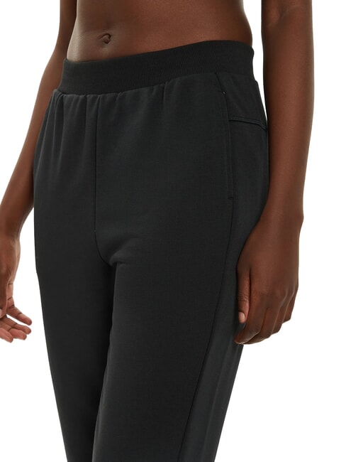 CK PERFORMANCE Pantalon de surv&ecirc;tement &eacute;lastique &agrave; la cheville beaut&eacute; noire - Costumes de sport pour femmes