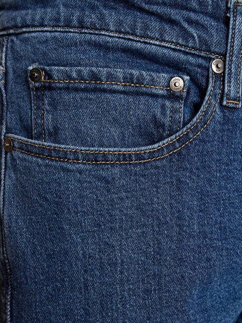 CK Jean slim &agrave; taille r&eacute;guli&egrave;re denim moyen - Jeans